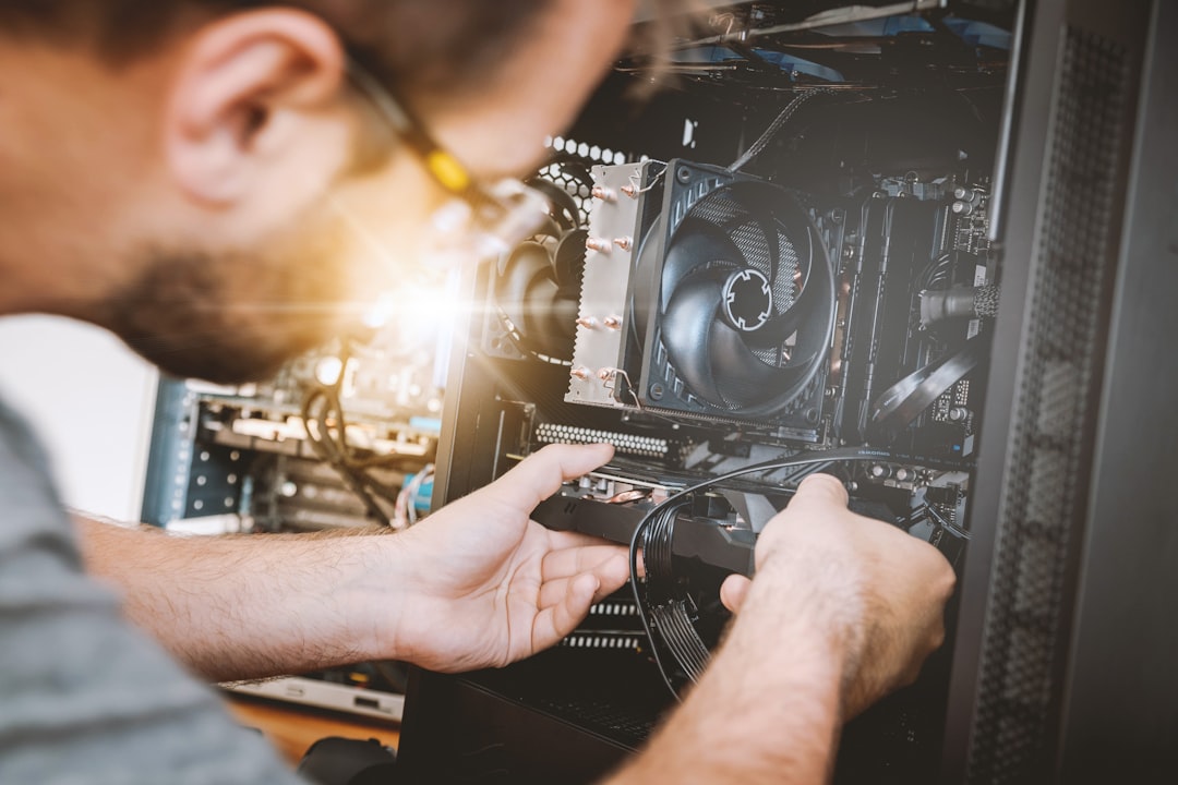 person-installing-graphics-card-in-computer-smkuyiasydm